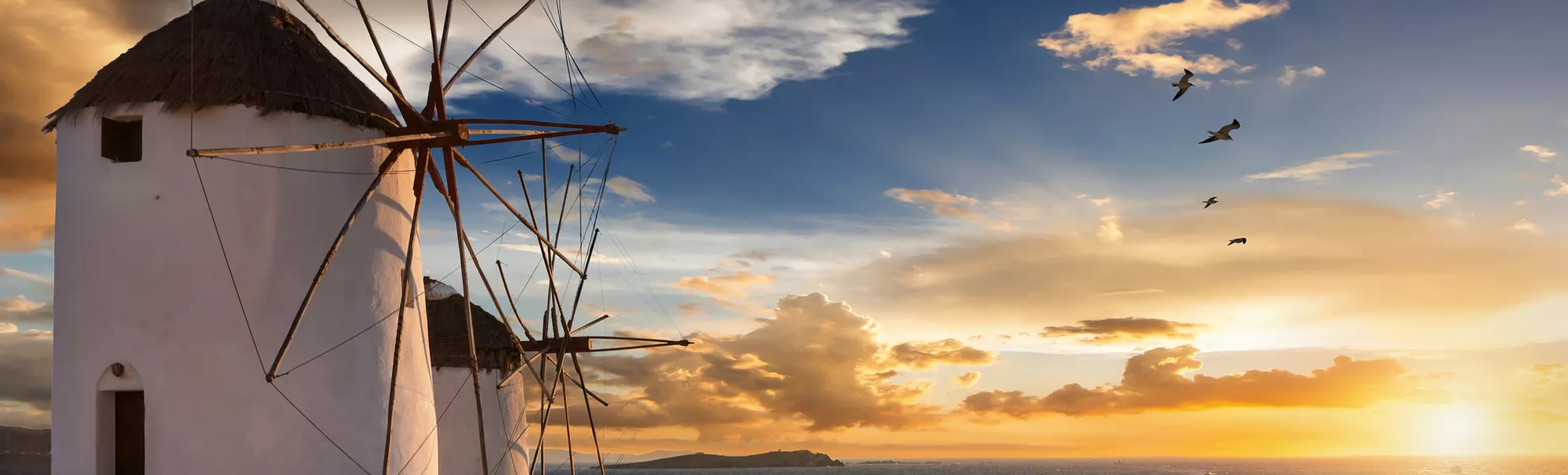 Windmühlen von Mykonos bei Sonnenuntergang - ©moofushi - stock.adobe.com